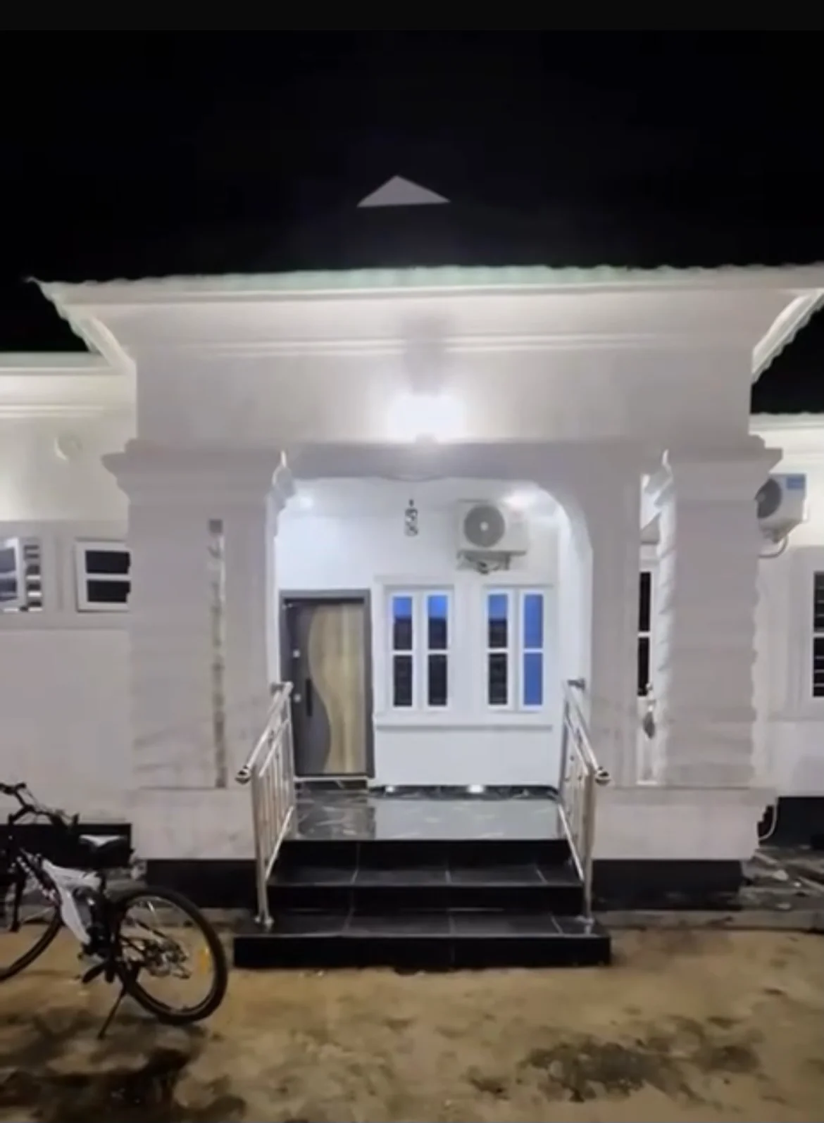 Laimon Apartment exterior and entrance steps at night